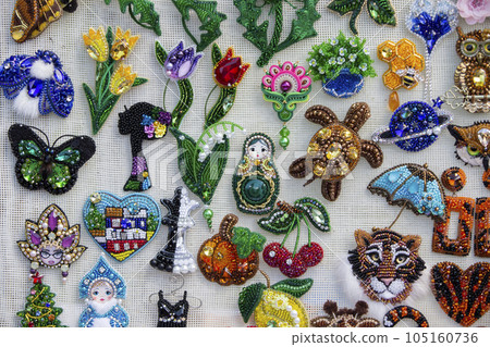 Beautiful diverse and colorful handmade brooches 105160736