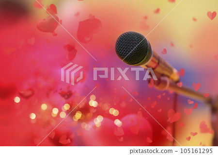 Stage golden microphone on the background of red valentine hearts and golden bokeh. Stage golden microphone on the background of red valentine hearts and golden bokeh. 105161295