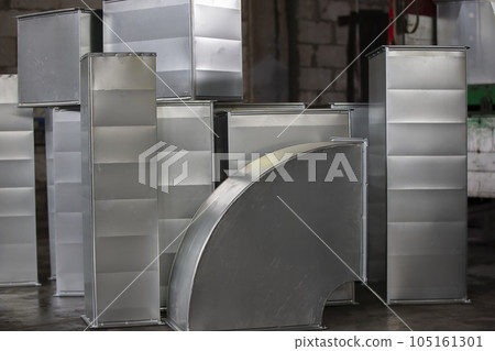 Metal stainless ventilation pipes at a metallurgical plant. Rolled metal. 105161301