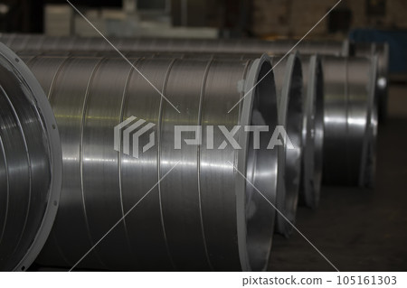 Metal stainless ventilation pipes at a metallurgical plant. Rolled metal. 105161303