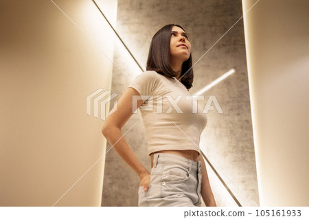 Close up of female portrait of attractive girl turns her head to the side and her hair fly Close up of female portrait of attractive girl turns her head to the side and her hair fly 105161933