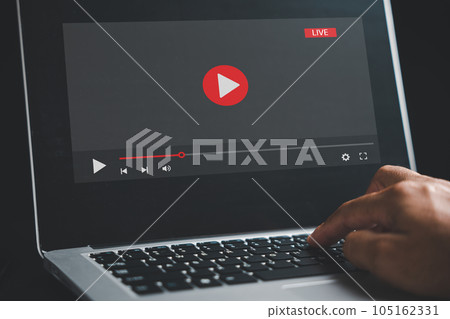 In the realm of online learning, a man dedicates himself to his laptop screen, seamlessly transitioning between video playback, educational webinars, and the digital landscape of e-learning. 105162331