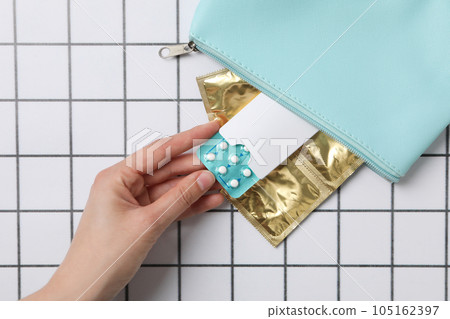 A bag with condoms and birth control pills A bag with condoms and birth control pills 105162397
