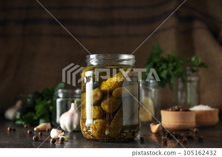 Tasty canned food concept, canned cucumbers, food for winter Tasty canned food concept, canned cucumbers, food for winter 105162432