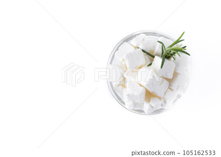 Feta cheese, cucumber and herbs in a bowl isolated on white background Feta cheese, cucumber and herbs in a bowl isolated on white background 105162533