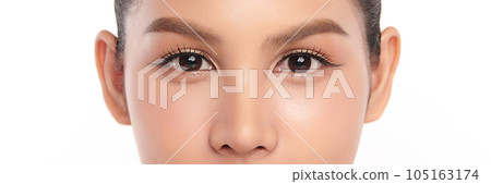 Close-up shot of beautiful Asian woman's eyes on white background. Close-up shot of beautiful Asian woman's eyes on white background. 105163174