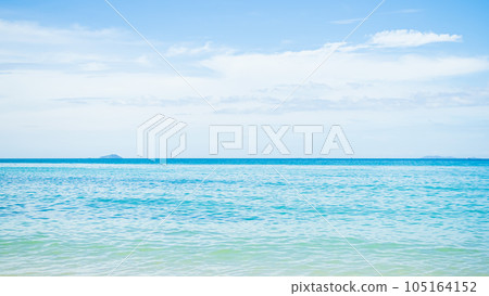 Blue Sea Shore Summer with Blue Sky Background,Cloud white Ocean Seascape,Water Wave,Beautiful Nature Coast Island,for Tourism Travel Vacation Tropical Holidays Concept. 105164152