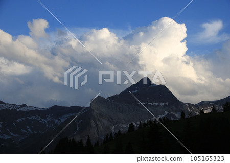 Bright lit cumulus cloud over Mount Oldehore. Bright lit cumulus cloud over Mount Oldehore. 105165323