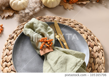 Thanksgiving day autumn table setting decoration in natural colors white pumpkins. Thanksgiving day autumn table setting decoration in natural colors white pumpkins. 105165706