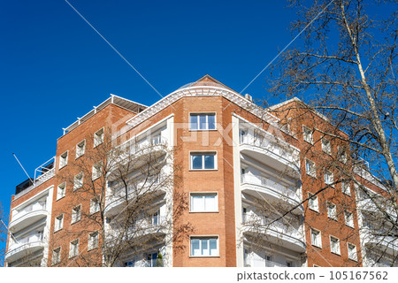 Luxury old residential buildings in Serrano Street in Madrid. Low angle view Luxury old residential buildings in Serrano Street in Madrid. Low angle view 105167562