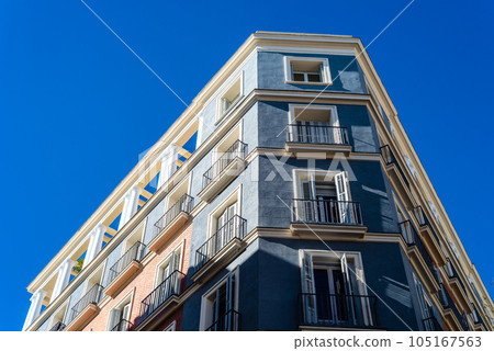 Luxury old residential buildings in Serrano Street in Madrid. Low angle view Luxury old residential buildings in Serrano Street in Madrid. Low angle view 105167563