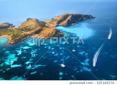 Aerial view of island, sea bay with clear azure water, boats Aerial view of island, sea bay with clear azure water, boats 105168370