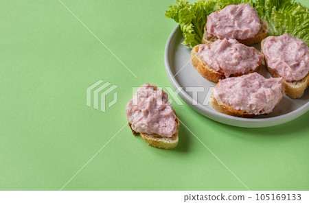 Tarama or taramasalata canape on the green background Tarama or taramasalata canape on the green background 105169133
