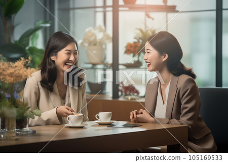 Two business women meeting at a table 105169533