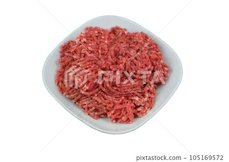 Bowl of mince isolated on white background. Homemade minced meat comes out of the meat grinder. Cooking a burger. 105169572