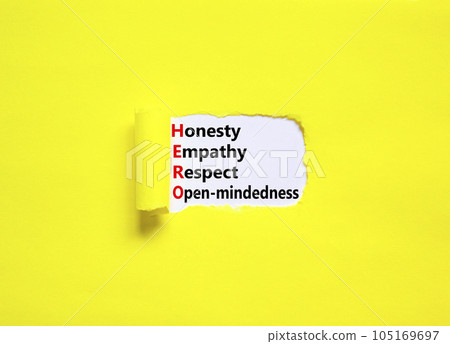 HERO honesty empathy respect open-mindedness symbol. Concept words HERO honesty empathy respect open-mindedness on white paper, yellow background. HERO honesty empathy respect open-mindedness concept. 105169697