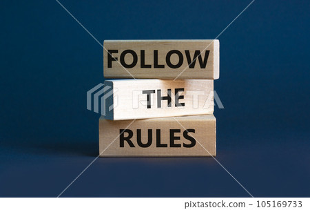 Follow the rules symbol. Concept words Follow the rules on wooden blocks. Beautiful grey background. Business and follow the rules concept. Copy space. Follow the rules symbol. Concept words Follow the rules on wooden blocks. Beautiful grey background. Business and follow the rules concept. Copy space. 105169733