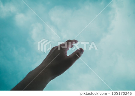 A hand stretching to the sky A hand stretching to the sky 105170246