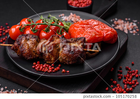 Delicious grilled chicken, turkey or pork skewers with salt, spices and herbs Delicious grilled chicken, turkey or pork skewers with salt, spices and herbs 105170258