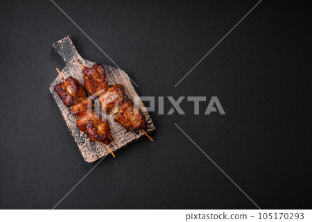 Delicious grilled chicken, turkey or pork skewers with salt, spices and herbs Delicious grilled chicken, turkey or pork skewers with salt, spices and herbs 105170293