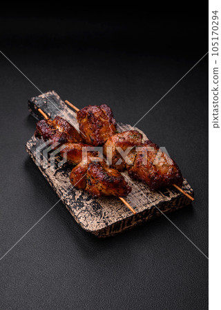 Delicious grilled chicken, turkey or pork skewers with salt, spices and herbs Delicious grilled chicken, turkey or pork skewers with salt, spices and herbs 105170294