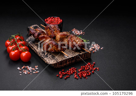 Delicious grilled chicken, turkey or pork skewers with salt, spices and herbs Delicious grilled chicken, turkey or pork skewers with salt, spices and herbs 105170296