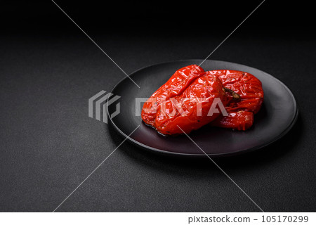 Delicious juicy grilled peppers with spices and herbs Delicious juicy grilled peppers with spices and herbs 105170299