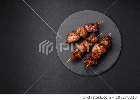 Delicious grilled chicken, turkey or pork skewers with salt, spices and herbs Delicious grilled chicken, turkey or pork skewers with salt, spices and herbs 105170330