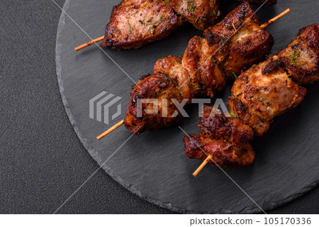 Delicious grilled chicken, turkey or pork skewers with salt, spices and herbs 105170336