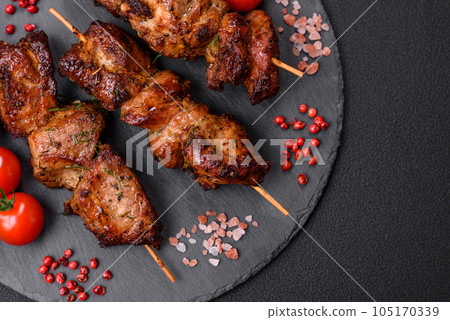 Delicious grilled chicken, turkey or pork skewers with salt, spices and herbs Delicious grilled chicken, turkey or pork skewers with salt, spices and herbs 105170339