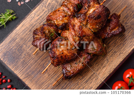 Delicious grilled chicken, turkey or pork skewers with salt, spices and herbs Delicious grilled chicken, turkey or pork skewers with salt, spices and herbs 105170366