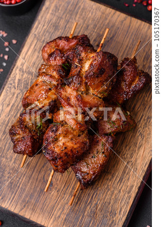 Delicious grilled chicken, turkey or pork skewers with salt, spices and herbs Delicious grilled chicken, turkey or pork skewers with salt, spices and herbs 105170367
