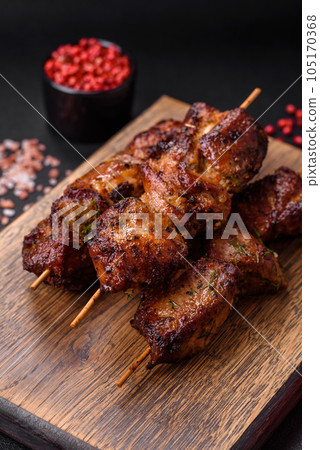 Delicious grilled chicken, turkey or pork skewers with salt, spices and herbs Delicious grilled chicken, turkey or pork skewers with salt, spices and herbs 105170368