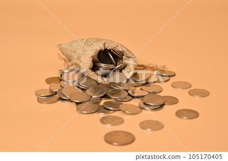 Money bag and stack of coins on background, Investment in future, Financial business investment, Growing money, People saving money, Money saving and financial banking 105170405