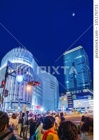 View of modern architecture in evening next to railroad station of Osaka (saturday evenung) View of modern architecture in evening next to railroad station of Osaka (saturday evenung) 105170733