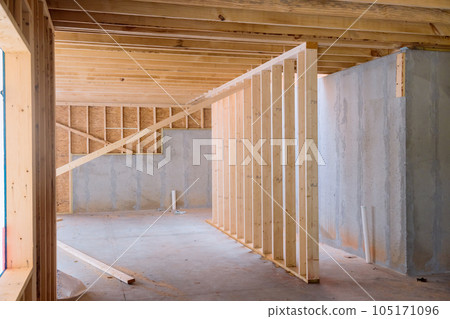 During construction is support beams built house with wooden framework frame in under construction During construction is support beams built house with wooden framework frame in under construction 105171096