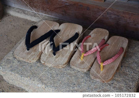 Two pairs of clogs at the entrance Two pairs of clogs at the entrance 105172832