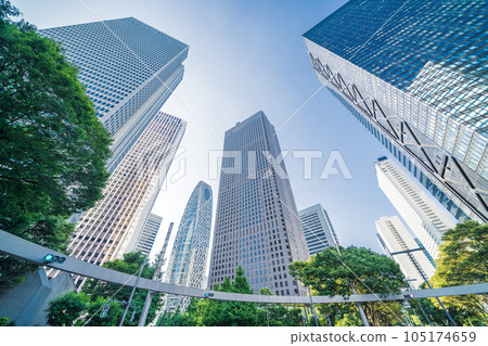 "Tokyo" The scenery of Shinjuku looking up at the blue sky and skyscrapers "Tokyo" The scenery of Shinjuku looking up at the blue sky and skyscrapers 105174659
