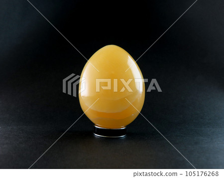 Orange calcite egg shape Orange calcite egg shape 105176268