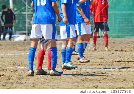 Soccer on a muddy ground (offside line) Soccer on a muddy ground (offside line) 105177598