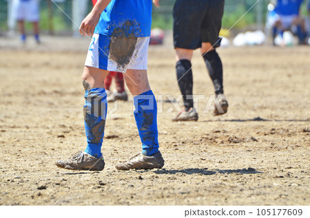 Soccer on a muddy ground 105177609