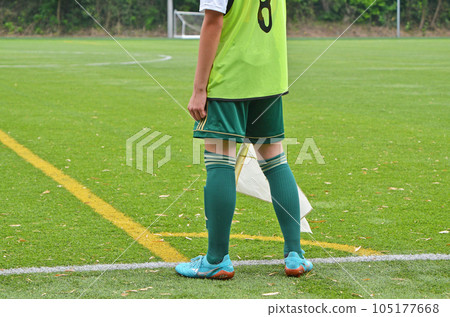Youth soccer referee (player with flag) Youth soccer referee (player with flag) 105177668