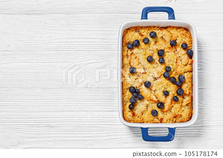 Apple Crumble topped with fresh berries, top view 105178174