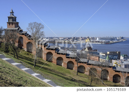 Ancient Kremlin with church and fortress on the Volga River and modern buildings in Nizhny Novgorod Ancient Kremlin with church and fortress on the Volga River and modern buildings in Nizhny Novgorod 105179389