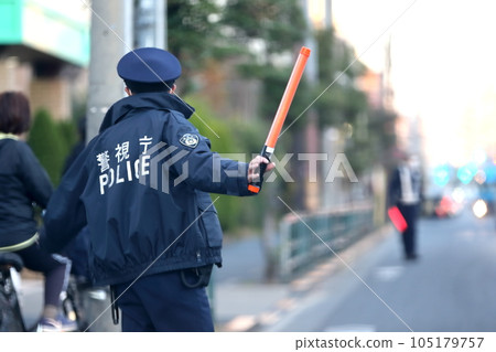 police officer directing traffic police officer directing traffic 105179757