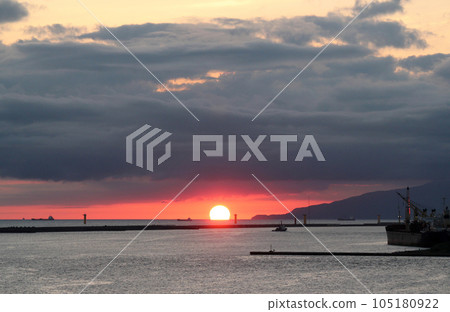 The sun setting over the Sea of Japan off the coast of Godzilla Rock on the Oga Peninsula The sun setting over the Sea of Japan off the coast of Godzilla Rock on the Oga Peninsula 105180922