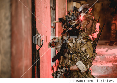 Expert team of soldiers attacking enemy during military operation 105181569