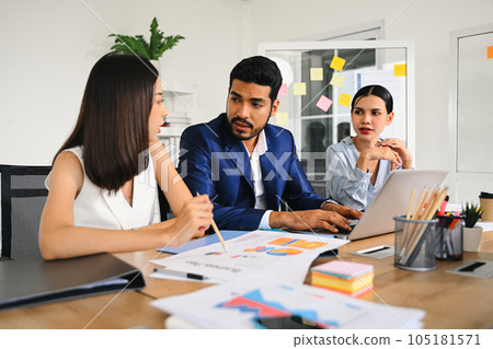 Happy group of business people meeting and brainstorming together at modern office, Business people planing business project, People in smart casual wear discussing and working. High quality photo 105181571