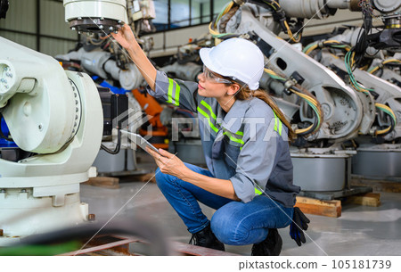 Female engineer worker working with robotic machine automation 105181739
