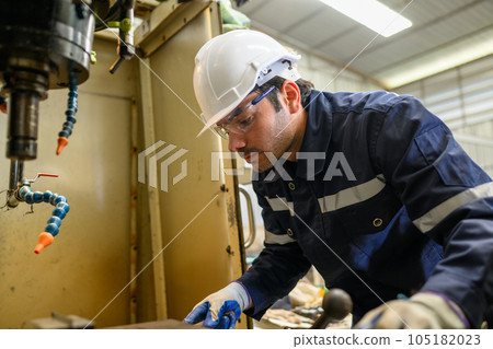 Engineer technician controlling robotic arms on computer laptop Engineer technician controlling robotic arms on computer laptop 105182023